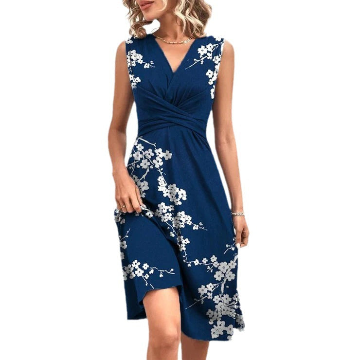 Navy blue floral midi dress with a v-neck design, perfect for summer elegance. Available in various sizes.