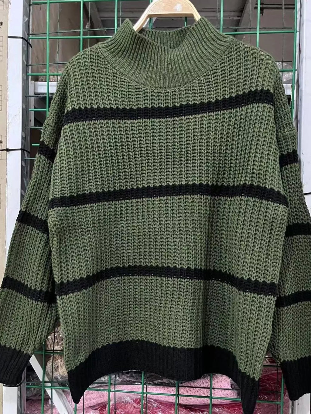 Elegant plus size sweater featuring a stylish striped pattern, perfect for sophisticated and comfortable fashion.