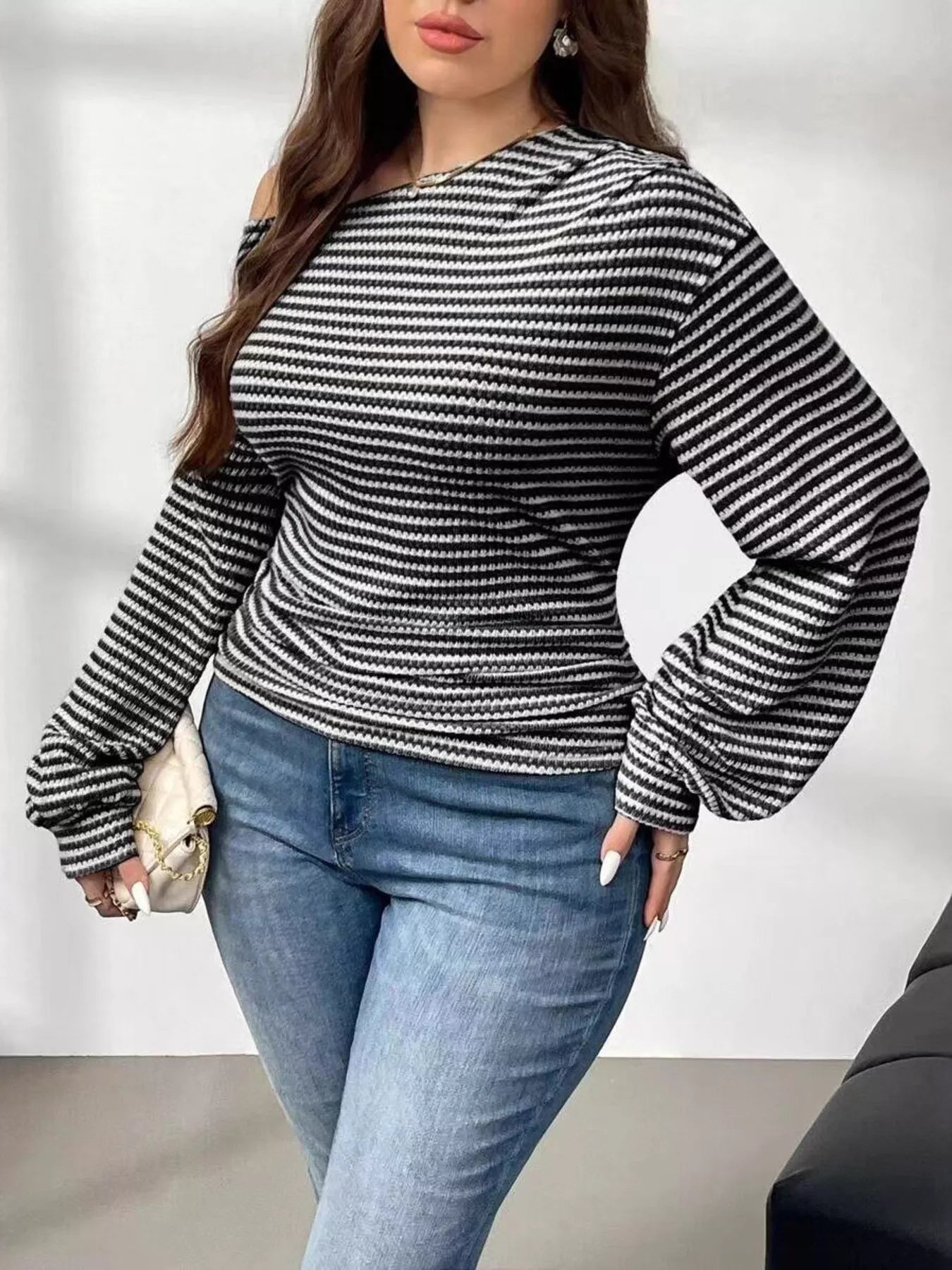 Plus size striped t-shirt featuring a classic design, comfortable fit, and stylish appearance for casual wear