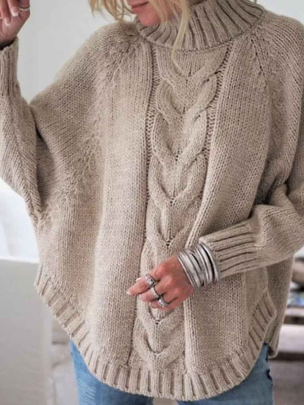 Cable-knit plus size sweater showcasing comfortable and stylish knitwear for all body types