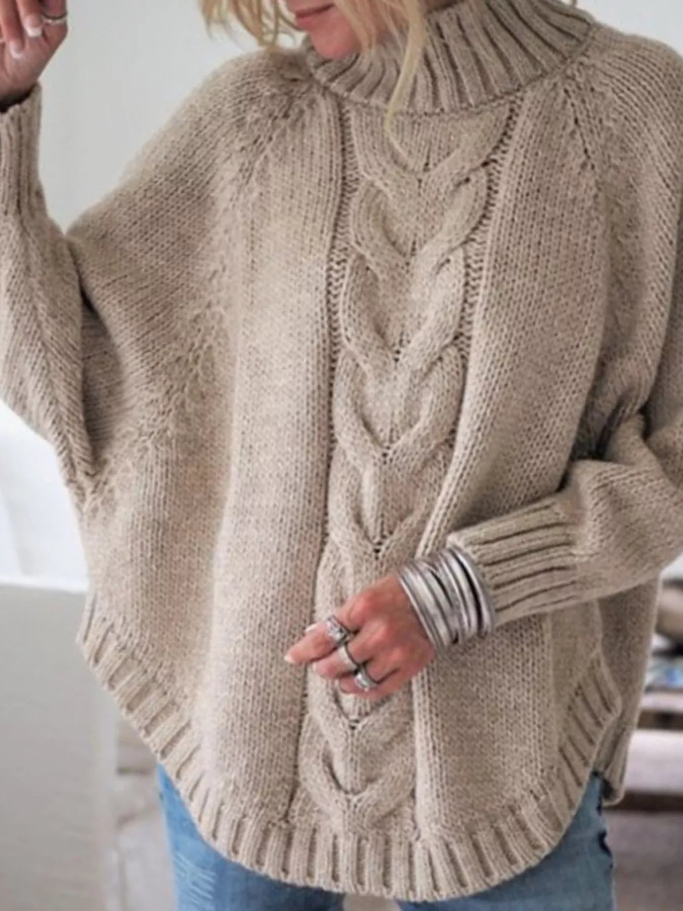 Cable-knit plus size sweater showcasing comfortable and stylish knitwear for all body types