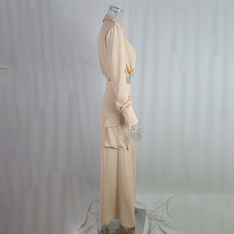 Womens plus size pant set in soft beige, featuring a crisscross top and flowy wide-leg pants with side pockets.