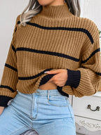 Elegant plus size sweater featuring a stylish striped pattern, perfect for sophisticated and comfortable fashion.