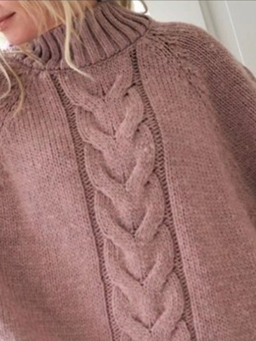 Cable-knit plus size sweater showcasing comfortable and stylish knitwear for all body types