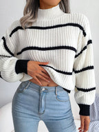 Elegant plus size sweater featuring a stylish striped pattern, perfect for sophisticated and comfortable fashion.