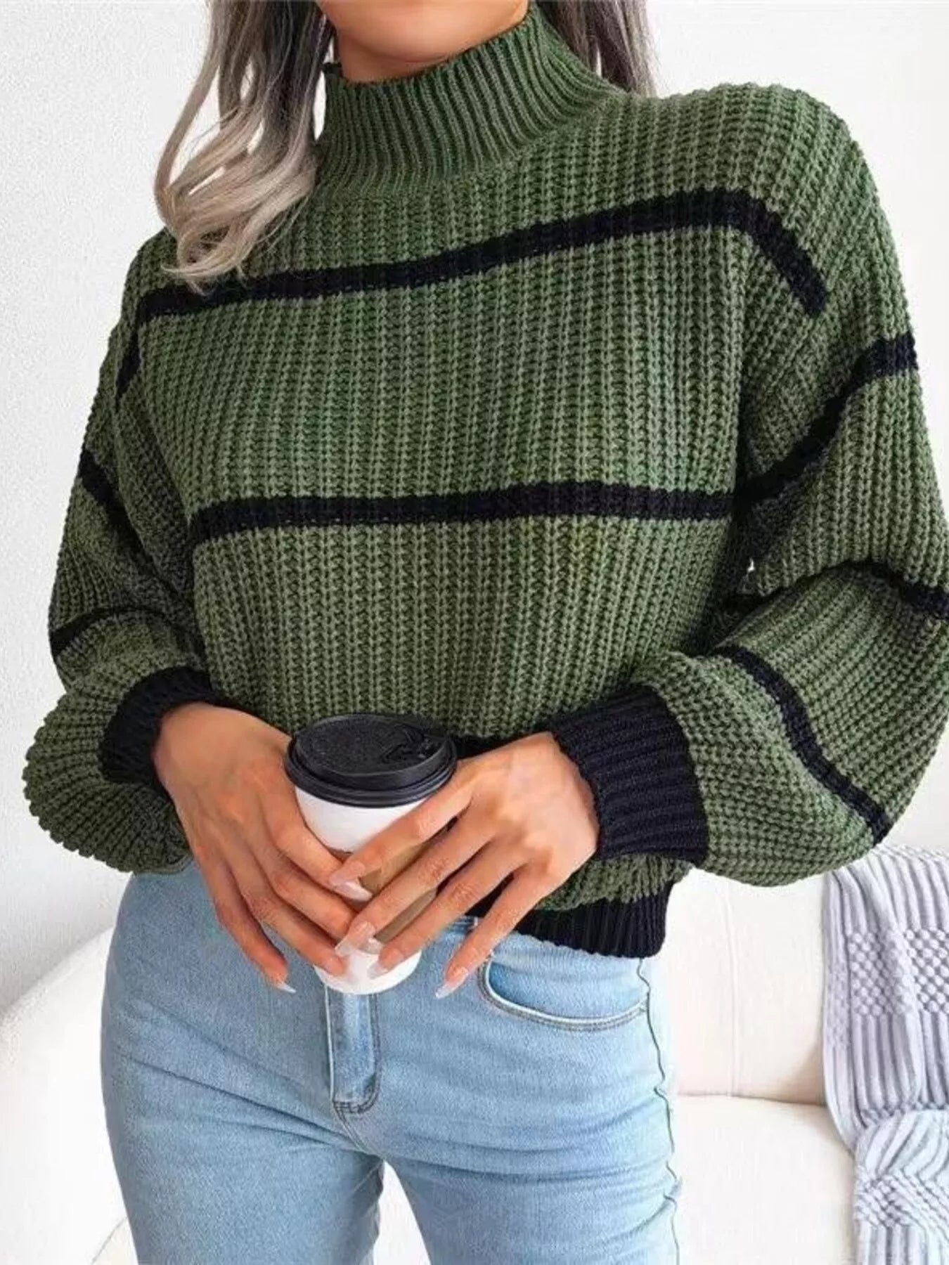 Elegant plus size sweater featuring a stylish striped pattern, perfect for sophisticated and comfortable fashion.