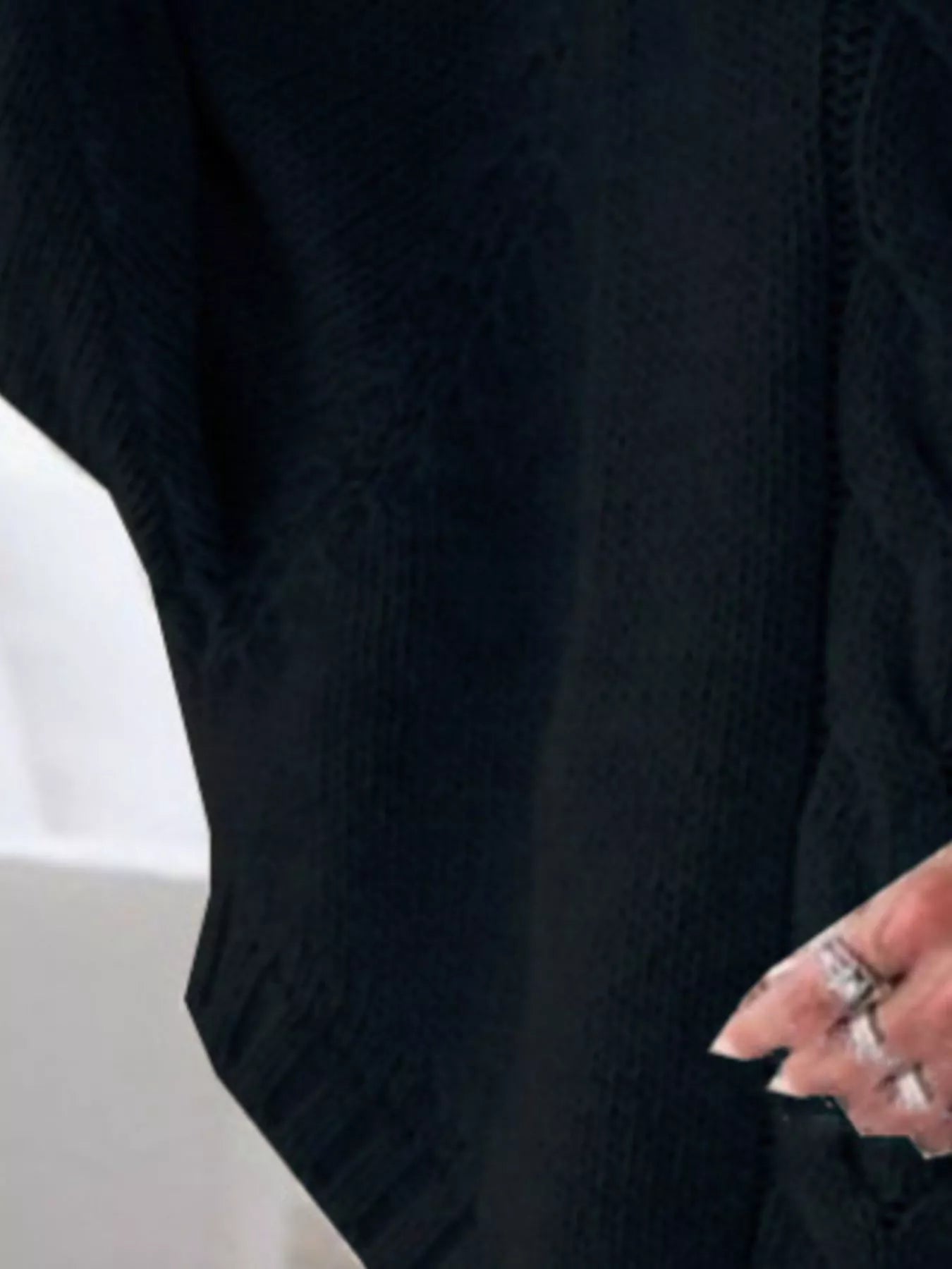 Cable-knit plus size sweater showcasing comfortable and stylish knitwear for all body types