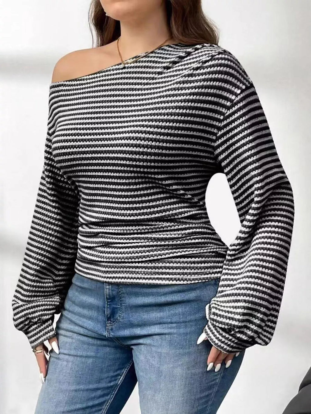 Plus size striped t-shirt featuring a classic design, comfortable fit, and stylish appearance for casual wear