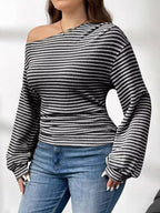 Plus size striped t-shirt featuring a classic design, comfortable fit, and stylish appearance for casual wear