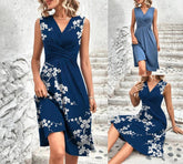 Navy blue floral midi dress with a v-neck, perfect for summer elegance, available in multiple sizes. Polyester fabric.