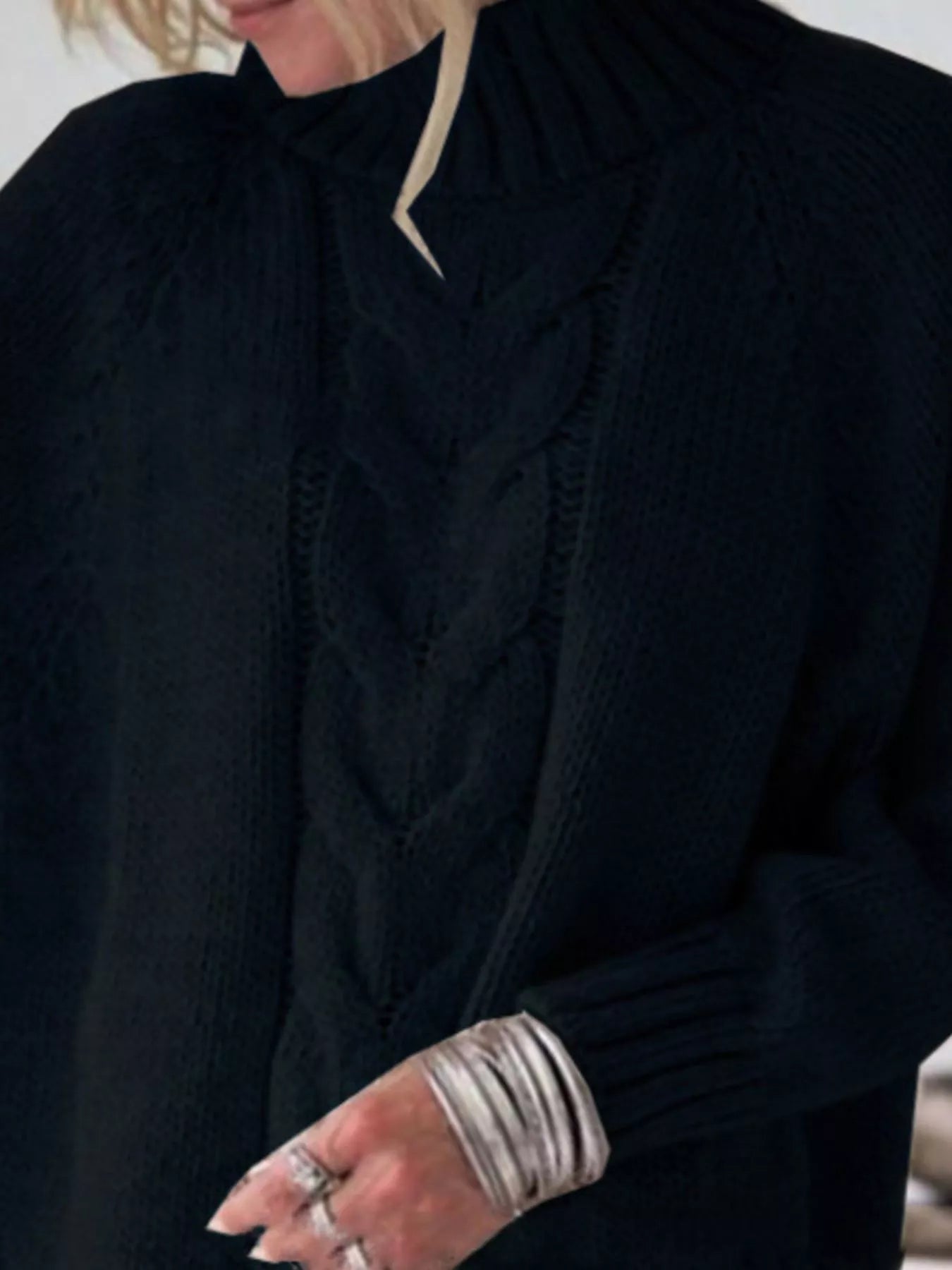 Cable-knit plus size sweater showcasing comfortable and stylish knitwear for all body types