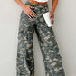 Stylish green camo denim cargo pants showcasing rugged durability and contemporary urban fashion.
