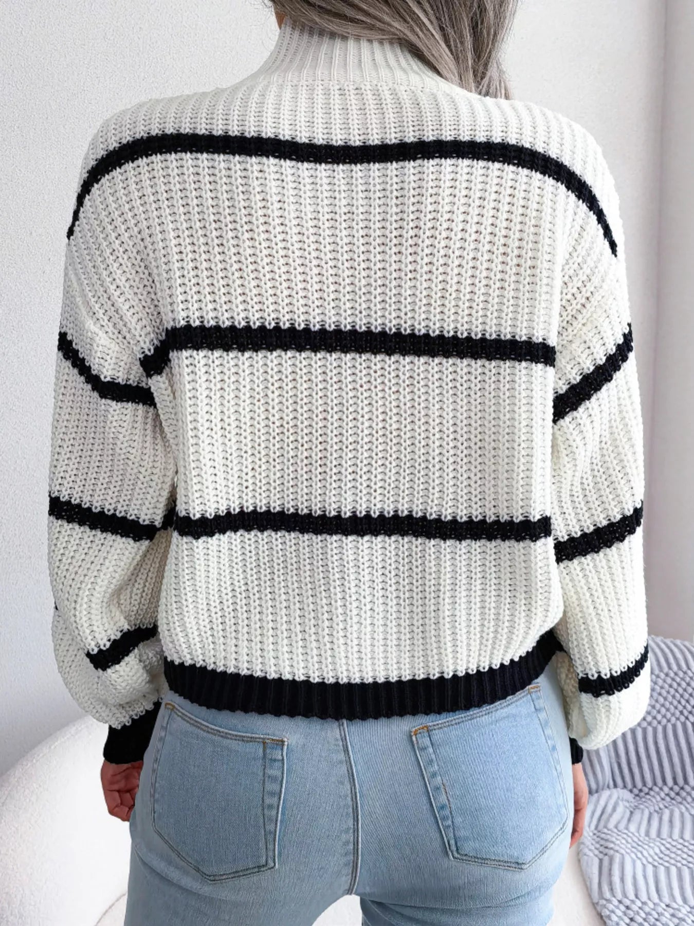 Elegant plus size sweater featuring a stylish striped pattern, perfect for sophisticated and comfortable fashion.