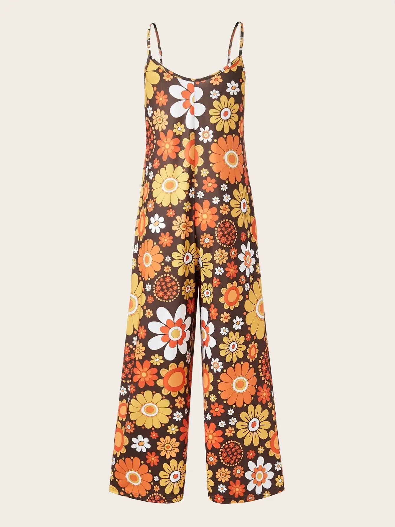 Woman wearing a loose floral print jumpsuit with thin straps.
