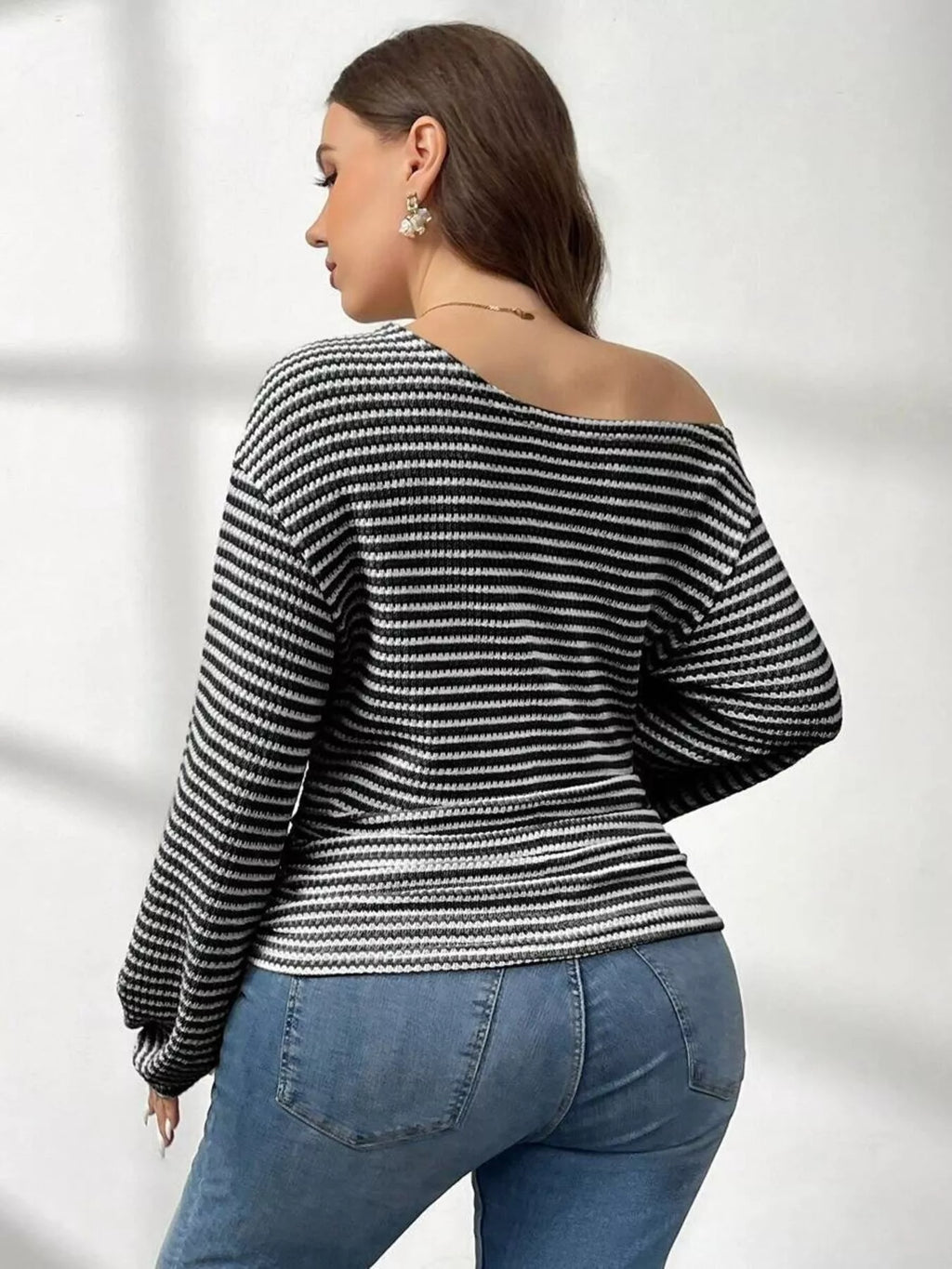 Plus size striped t-shirt featuring a classic design, comfortable fit, and stylish appearance for casual wear