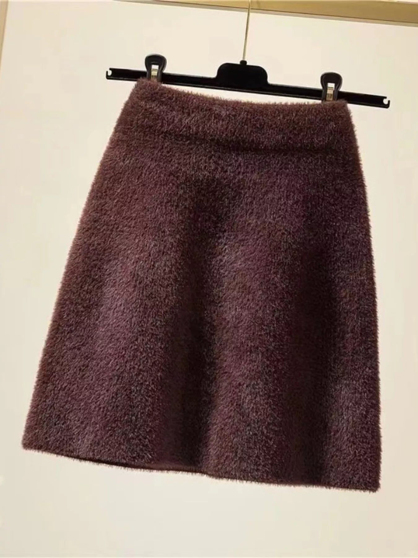 Elegant comfort plush mini skirt for stylish and cozy wear, perfect for versatile fashion.