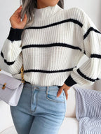 Elegant plus size sweater featuring a stylish striped pattern, perfect for sophisticated and comfortable fashion.