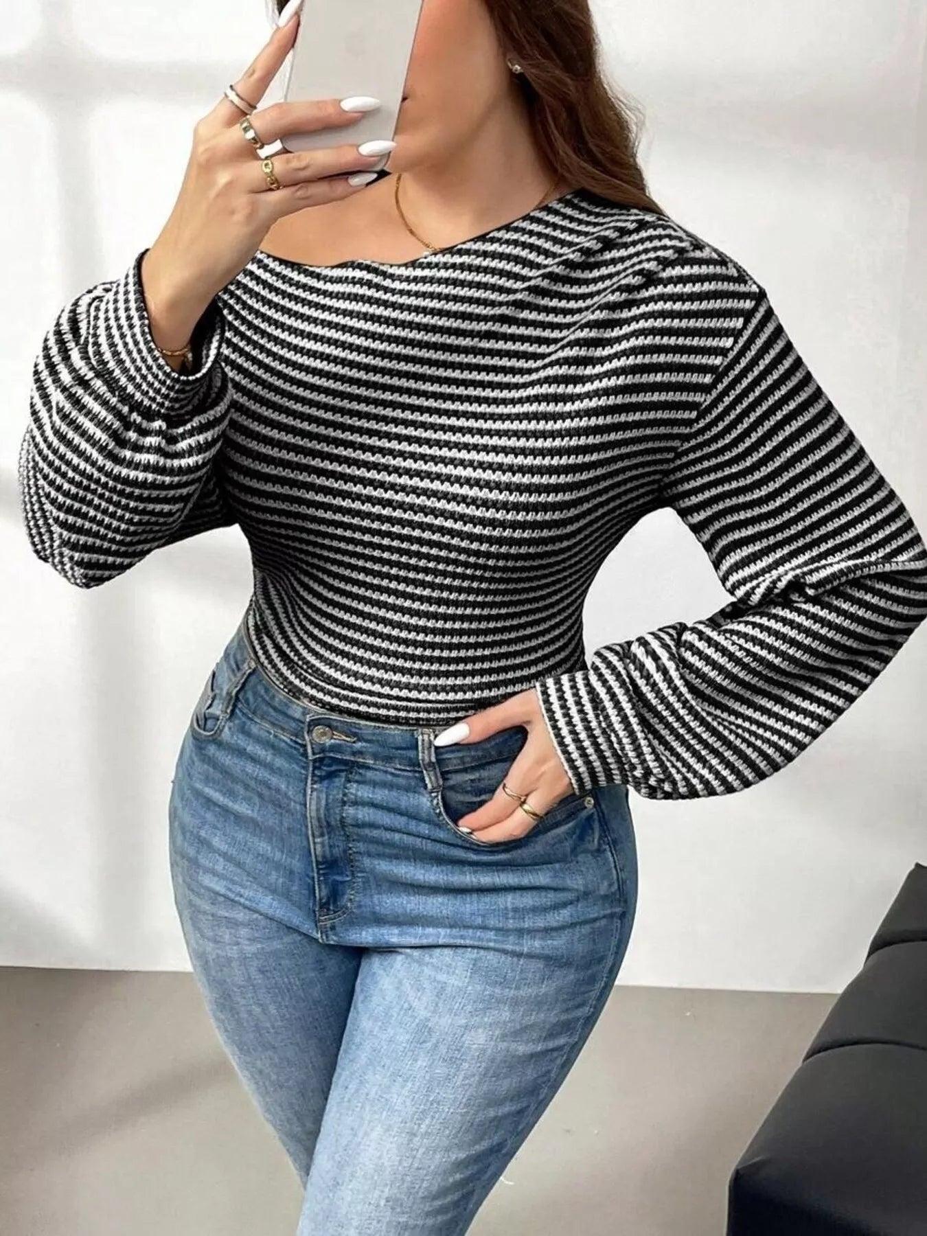 Plus size striped t-shirt featuring a classic design, comfortable fit, and stylish appearance for casual wear