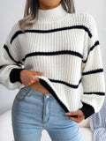 Elegant plus size sweater featuring a stylish striped pattern, perfect for sophisticated and comfortable fashion.