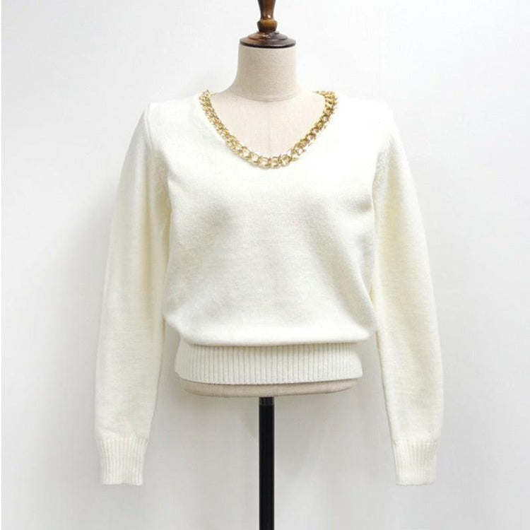 Elegant sweater displayed on a minimalist mannequin, showcasing refined style and premium knitwear quality for fashion enthusiasts.