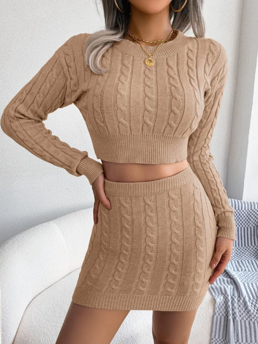 Cable-Knit Round Neck Top and Skirt Sweater Set.