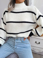 Elegant plus size sweater featuring a stylish striped pattern, perfect for sophisticated and comfortable fashion.