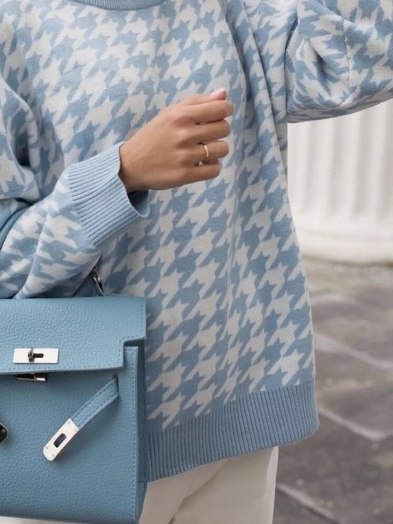 Plus size oversized sweater featuring a classic houndstooth pattern, perfect for stylish comfort.