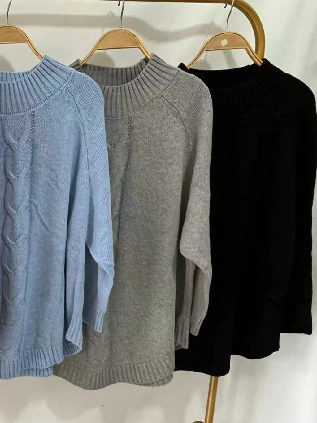 Cable-knit plus size sweater showcasing comfortable and stylish knitwear for all body types