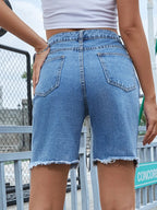 Stylish denim shorts made from high-quality denim fabric, perfect for casual summer wear and outdoor activities.