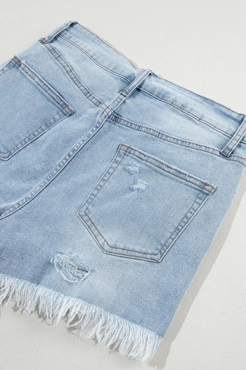 High waist denim shorts offering a stylish and comfortable summer fashion choice for women.