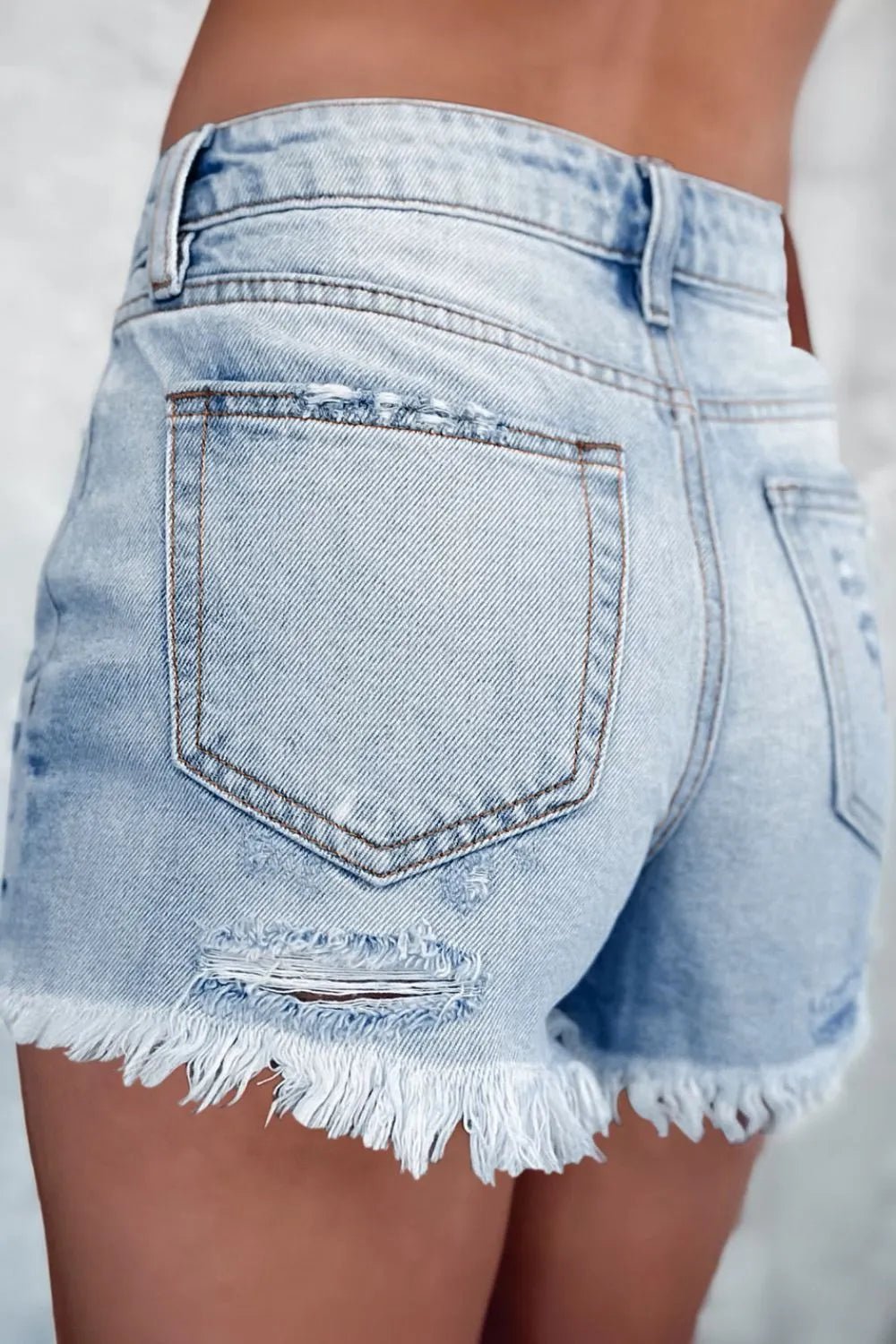 High waist denim shorts offering a stylish and comfortable summer fashion choice for women.