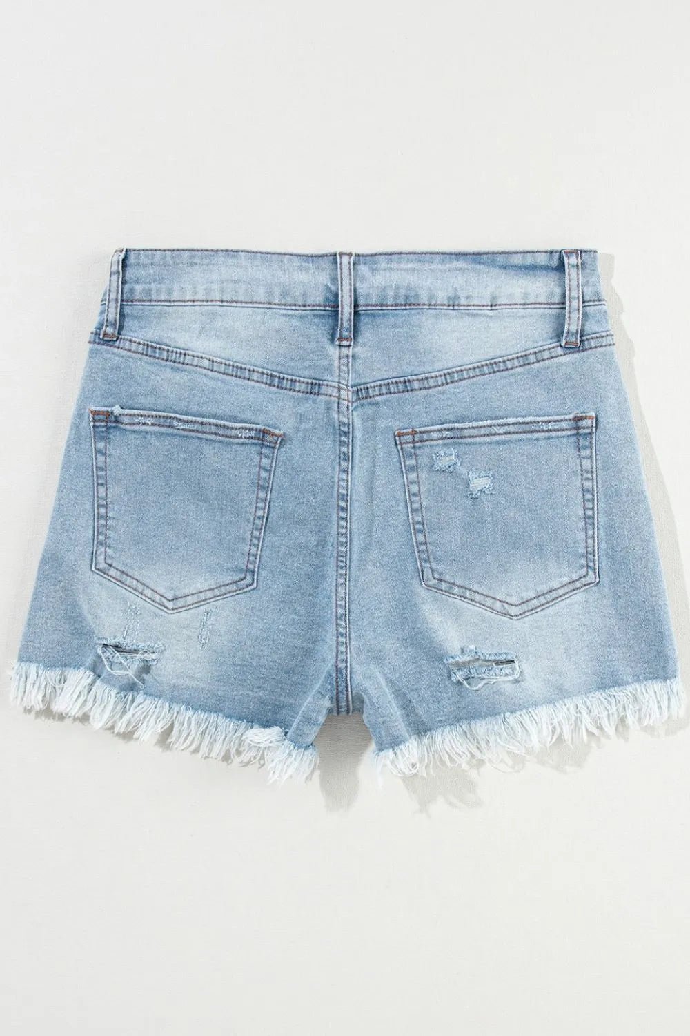 High waist denim shorts offering a stylish and comfortable summer fashion choice for women.