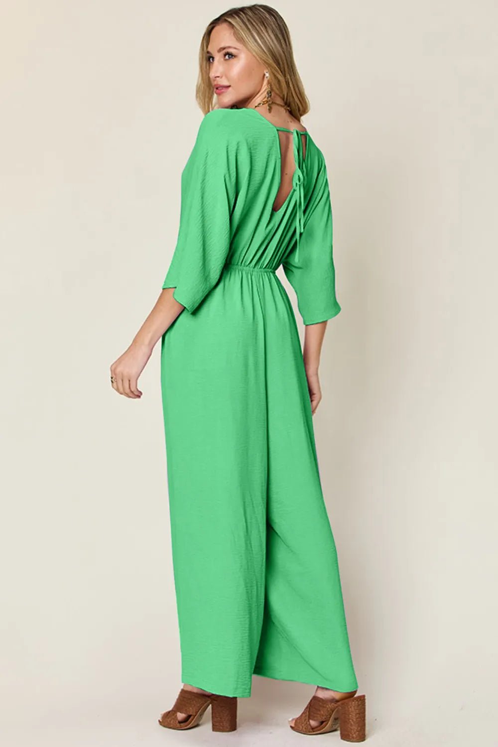 Double Take Full Size Surplice Wide Leg Jumpsuit with Pockets.