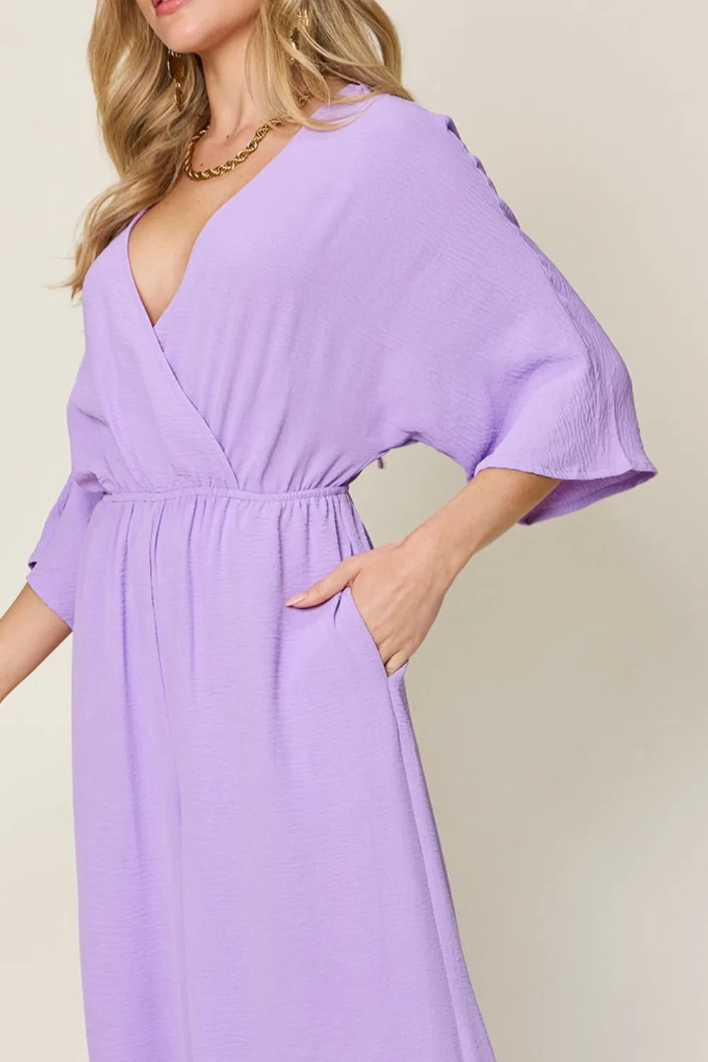 Double Take Full Size Surplice Wide Leg Jumpsuit with Pockets.