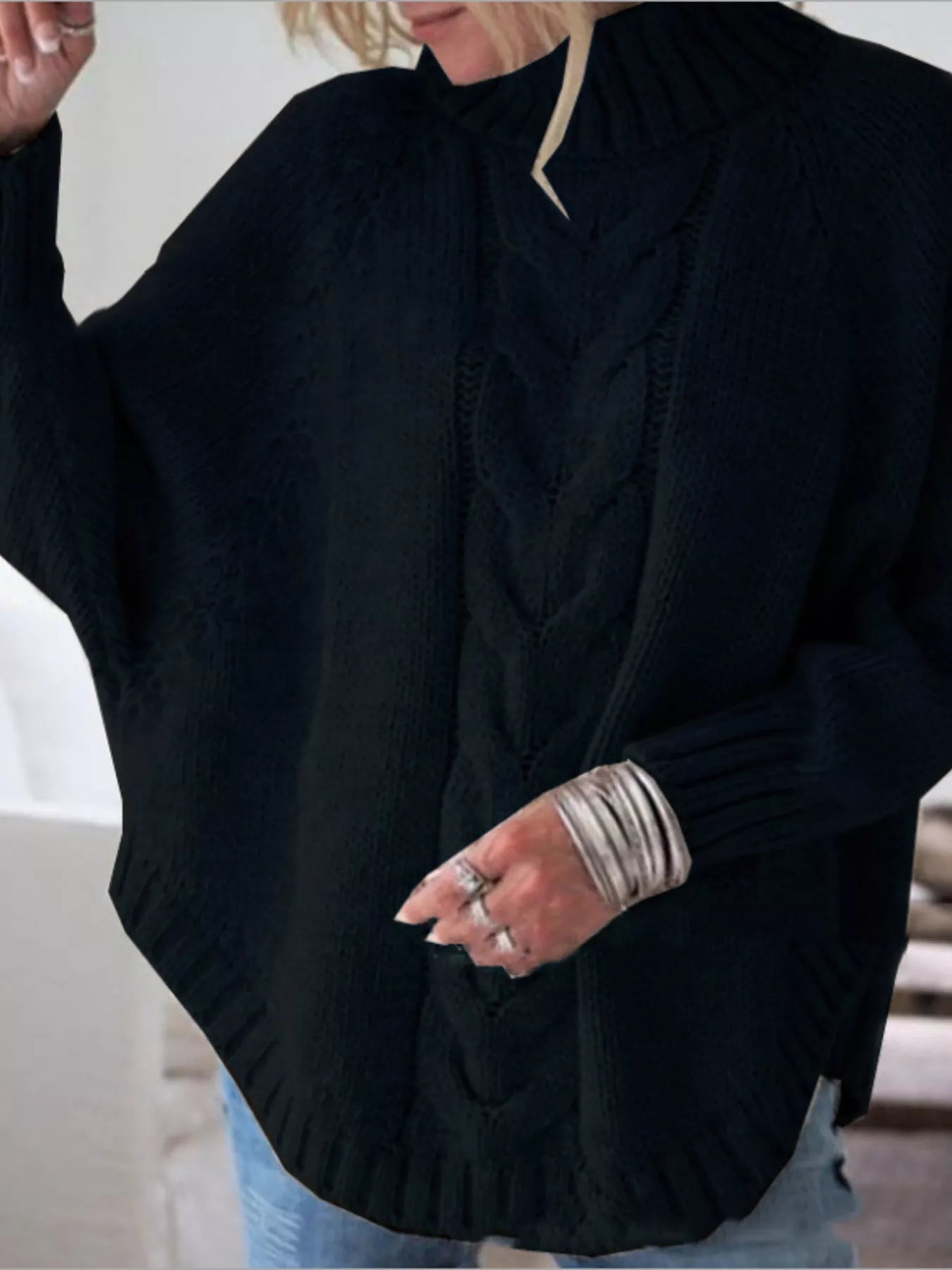 Cable-knit plus size sweater showcasing comfortable and stylish knitwear for all body types