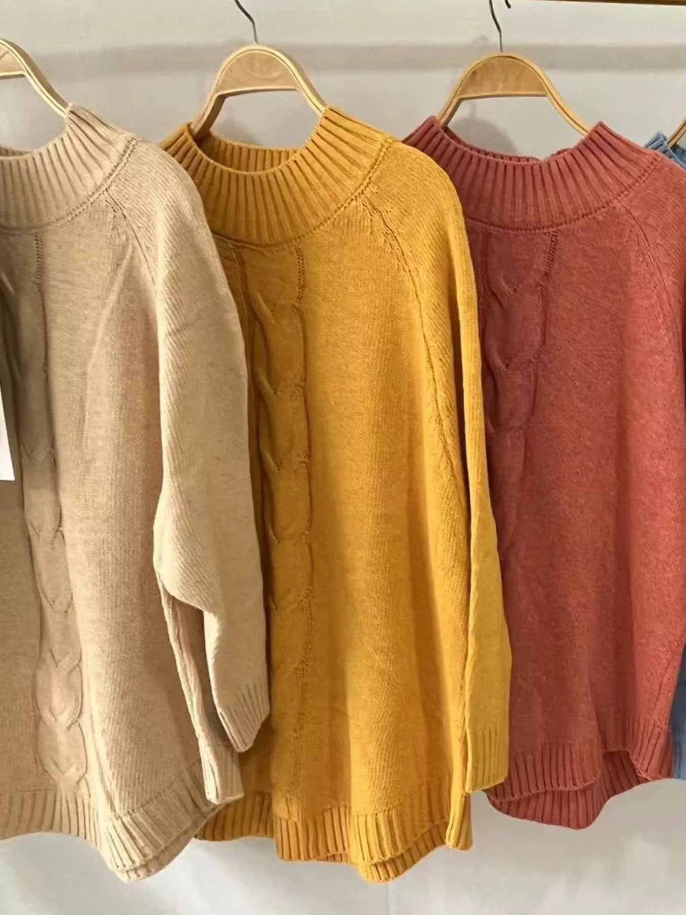 Cable-knit plus size sweater showcasing comfortable and stylish knitwear for all body types