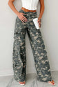 Stylish green camo denim cargo pants showcasing rugged durability and contemporary urban fashion.