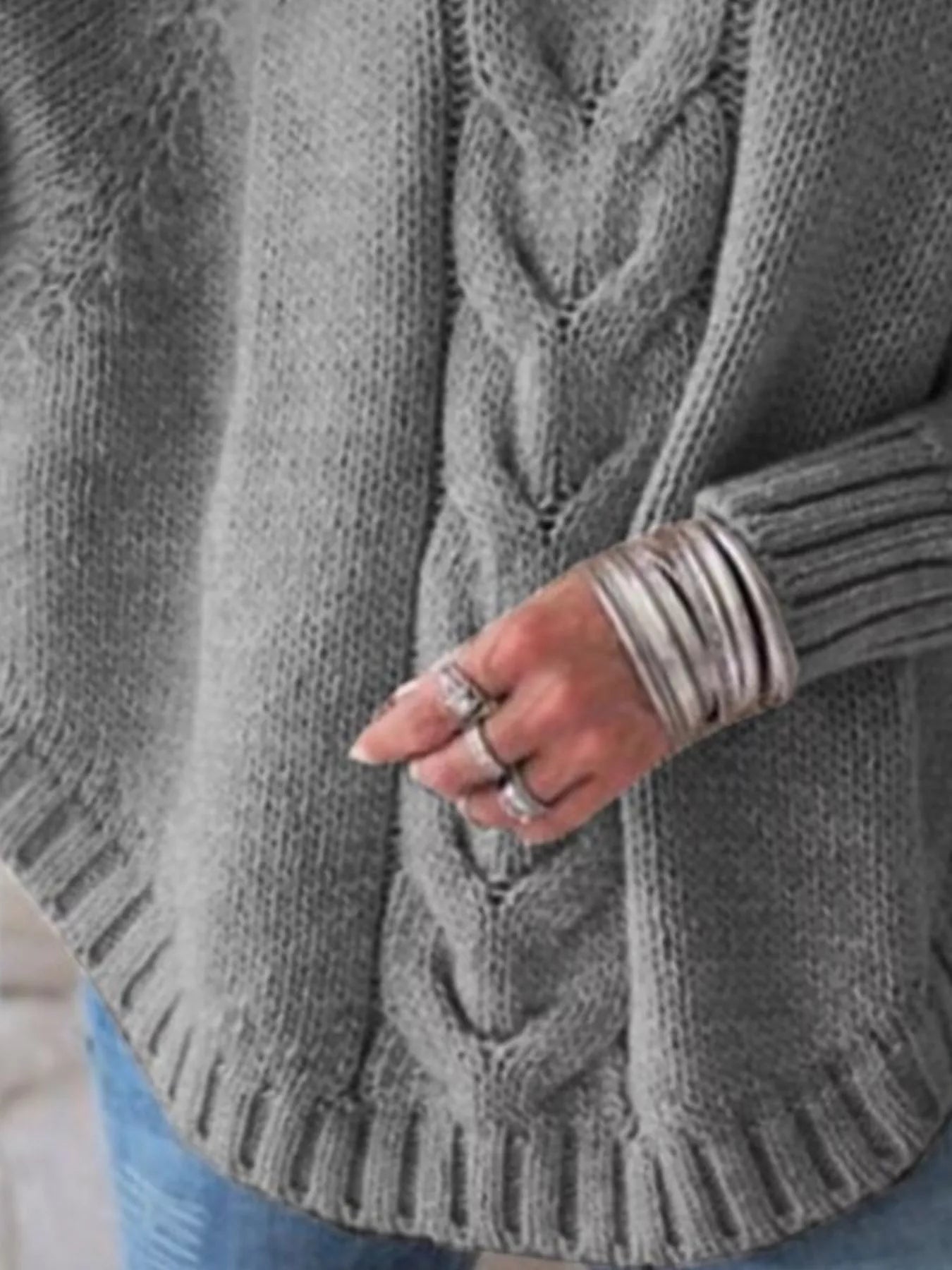 Cable-knit plus size sweater showcasing comfortable and stylish knitwear for all body types