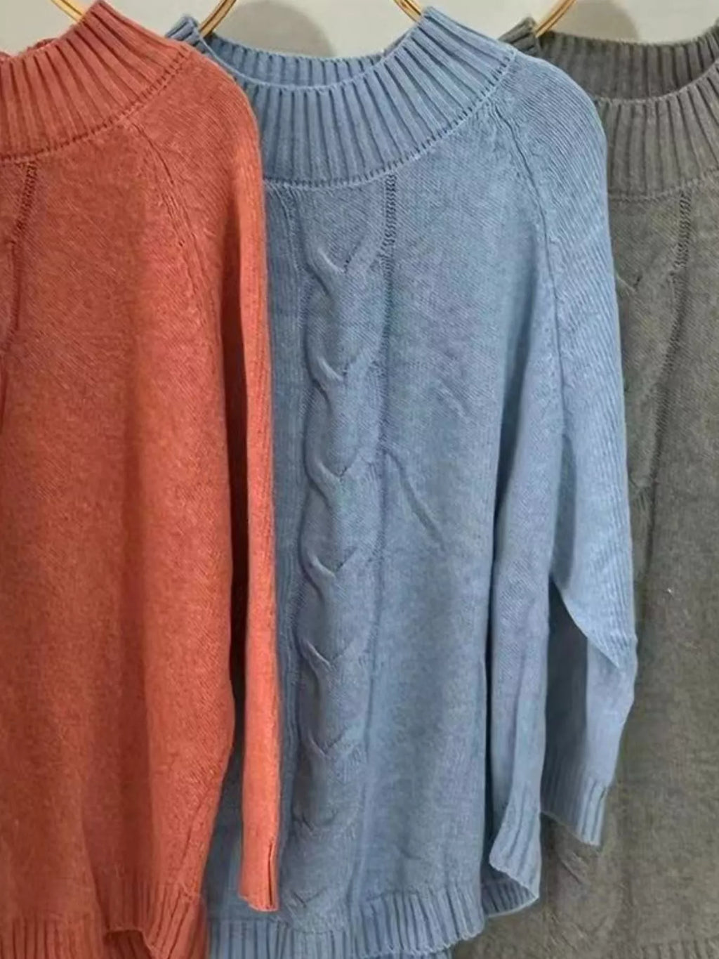 Cable-knit plus size sweater showcasing comfortable and stylish knitwear for all body types