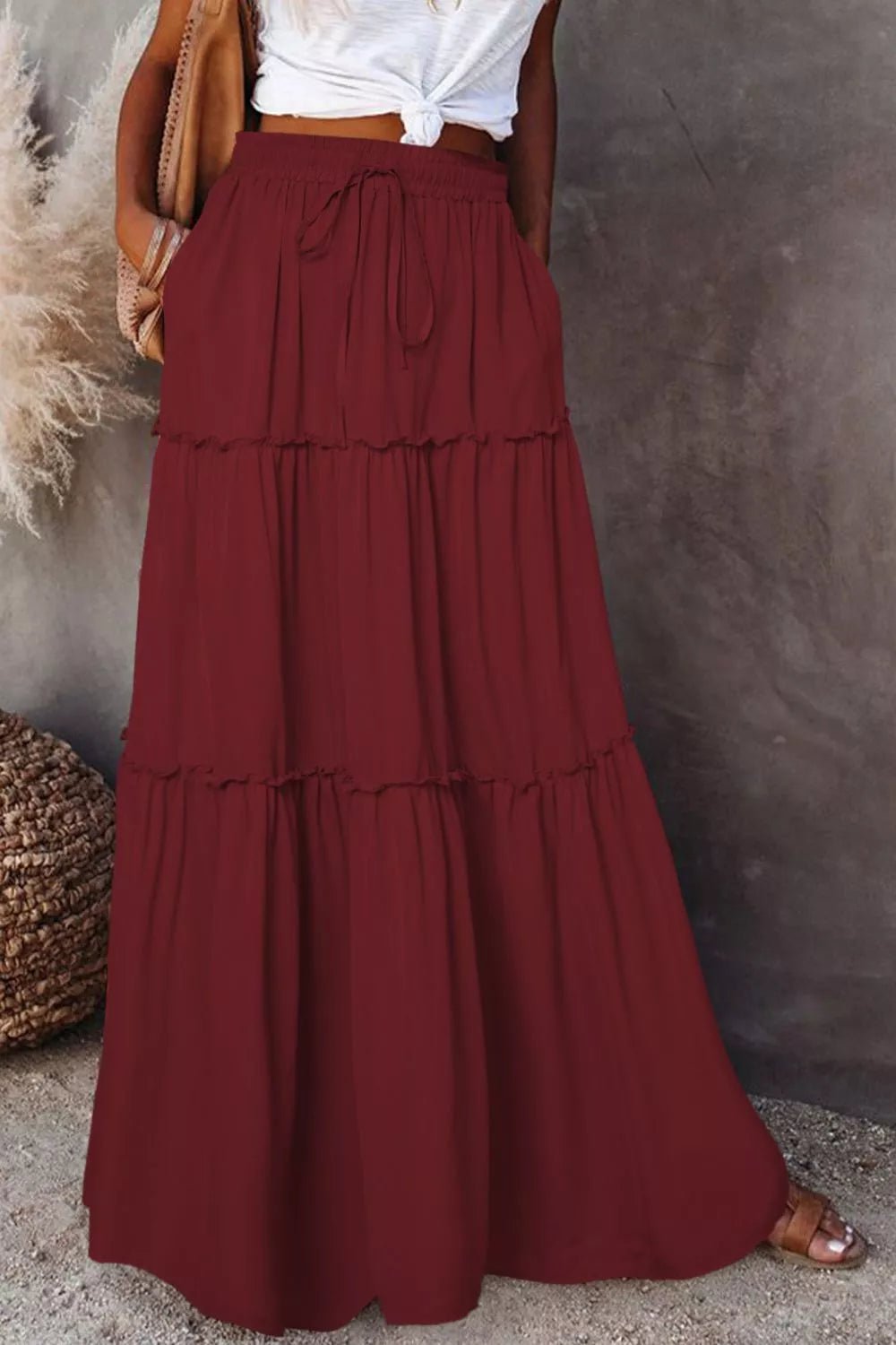 Elegant maxi skirt featuring a comfortable drawstring waist, perfect for stylish and versatile skirt options.