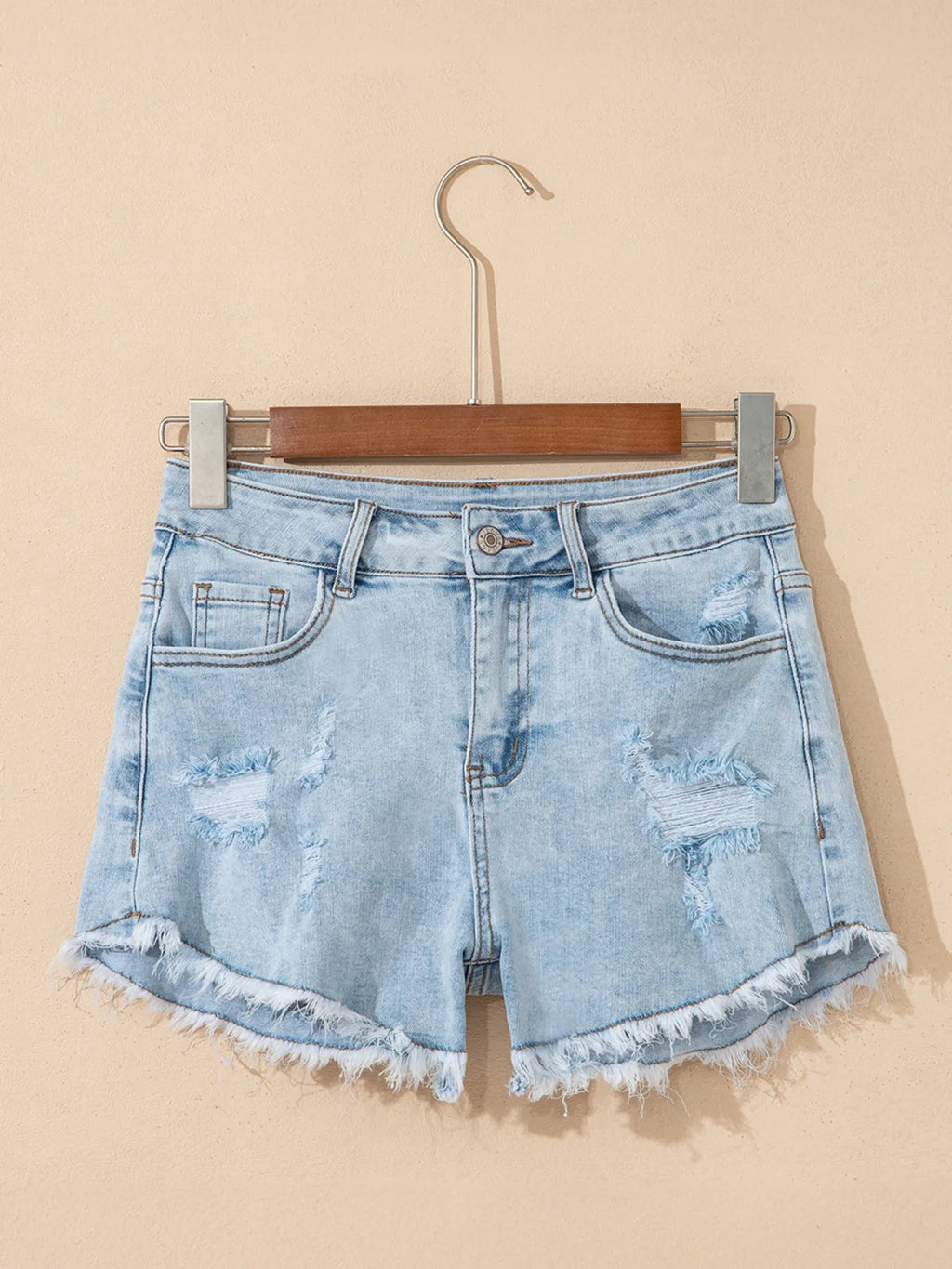 High rise denim shorts offering a stylish and comfortable fit for casual summer wear.
