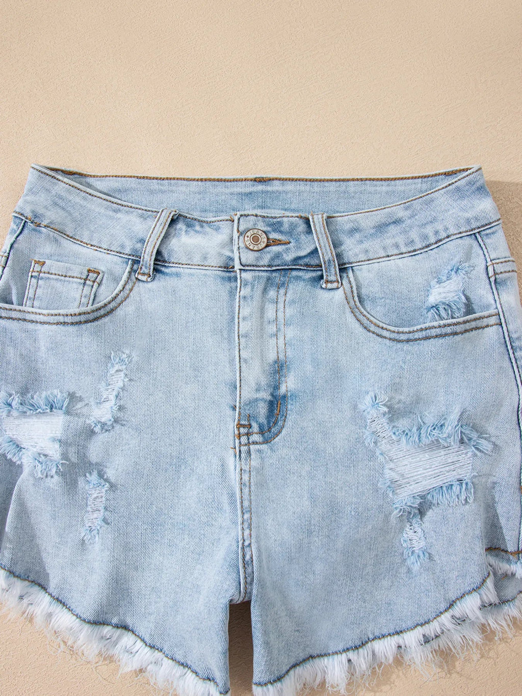 High rise denim shorts offering a stylish and comfortable fit for casual summer wear.