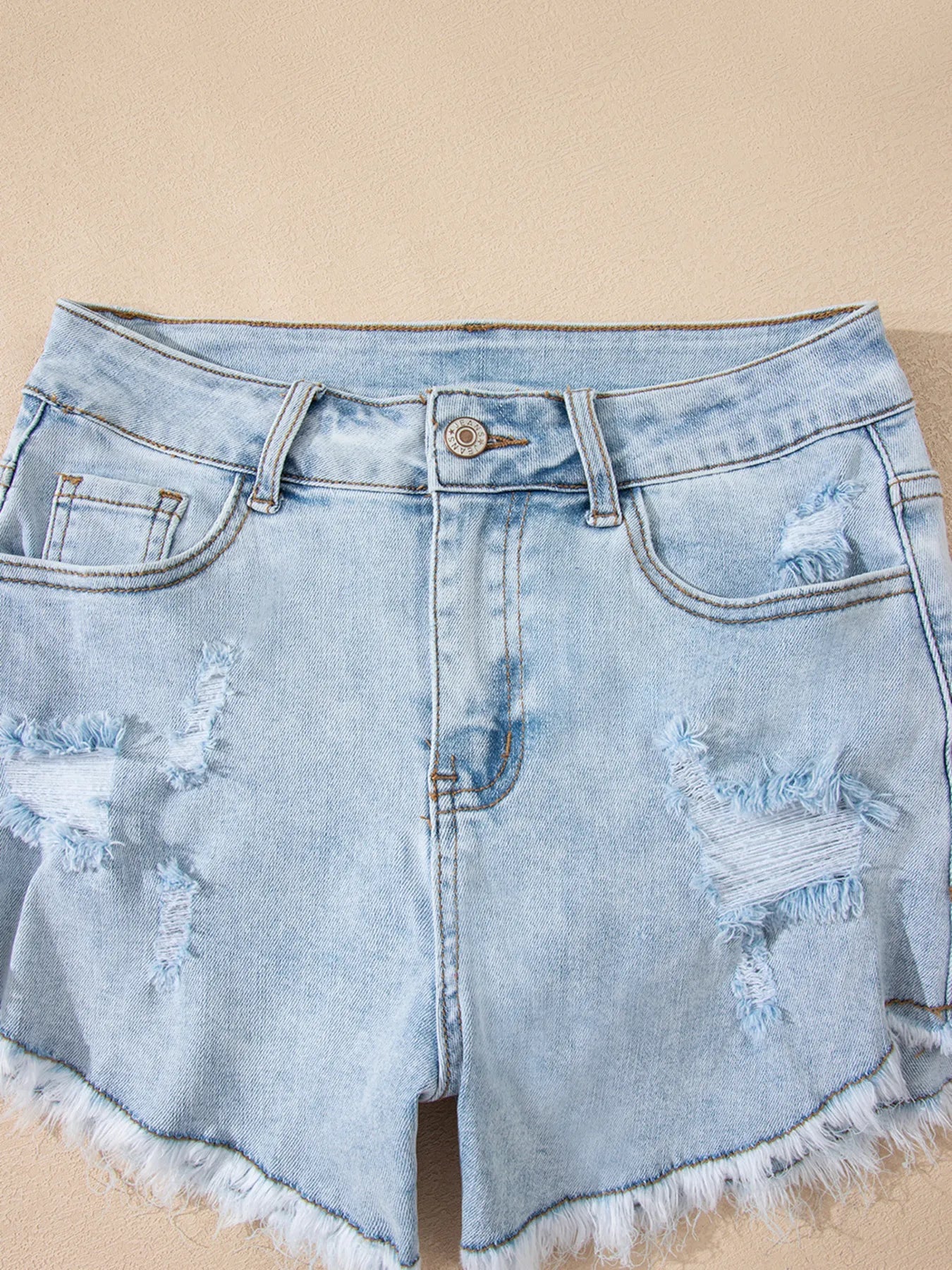 High rise denim shorts offering a stylish and comfortable fit for casual summer wear.