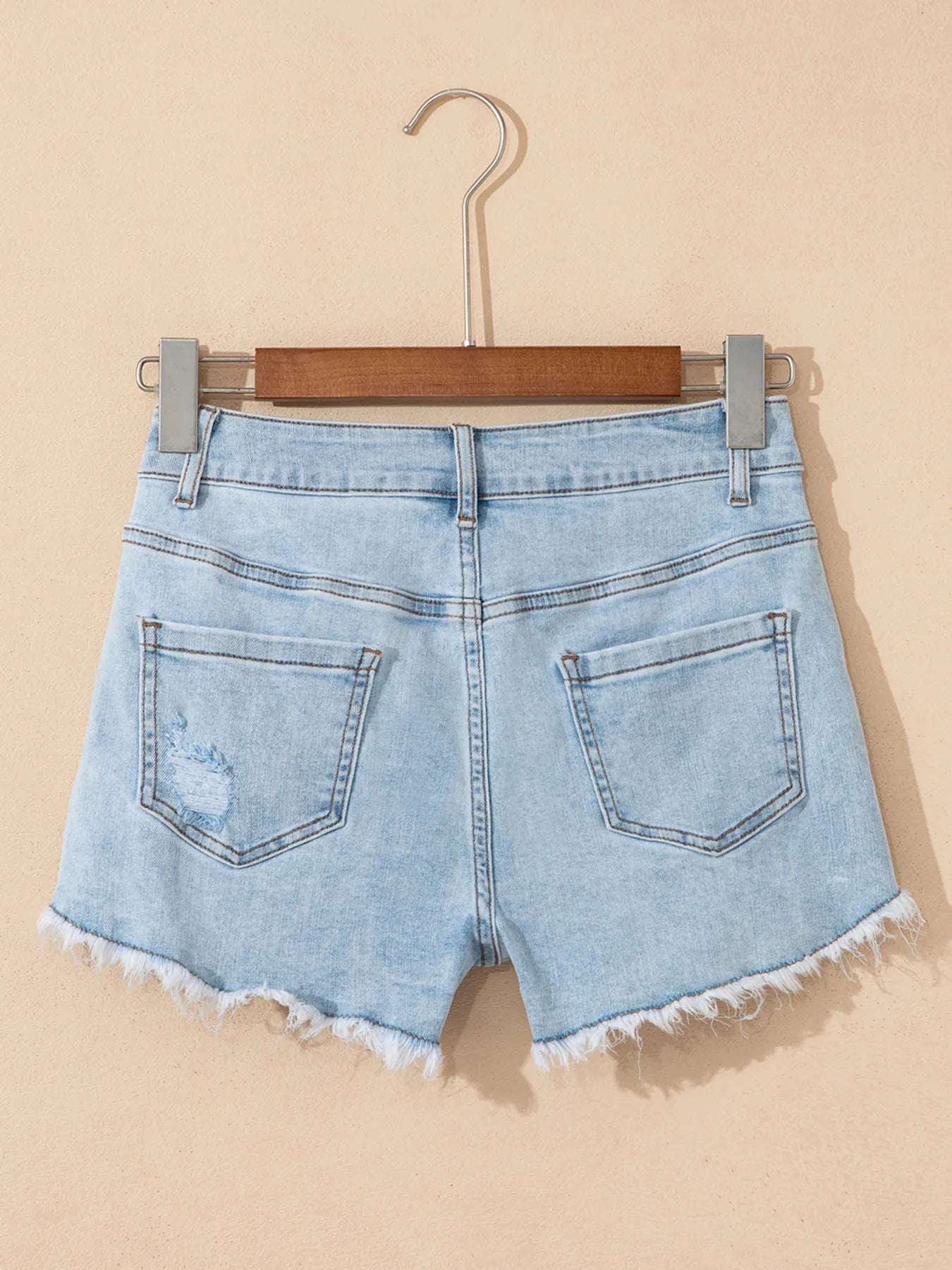 High rise denim shorts offering a stylish and comfortable fit for casual summer wear.
