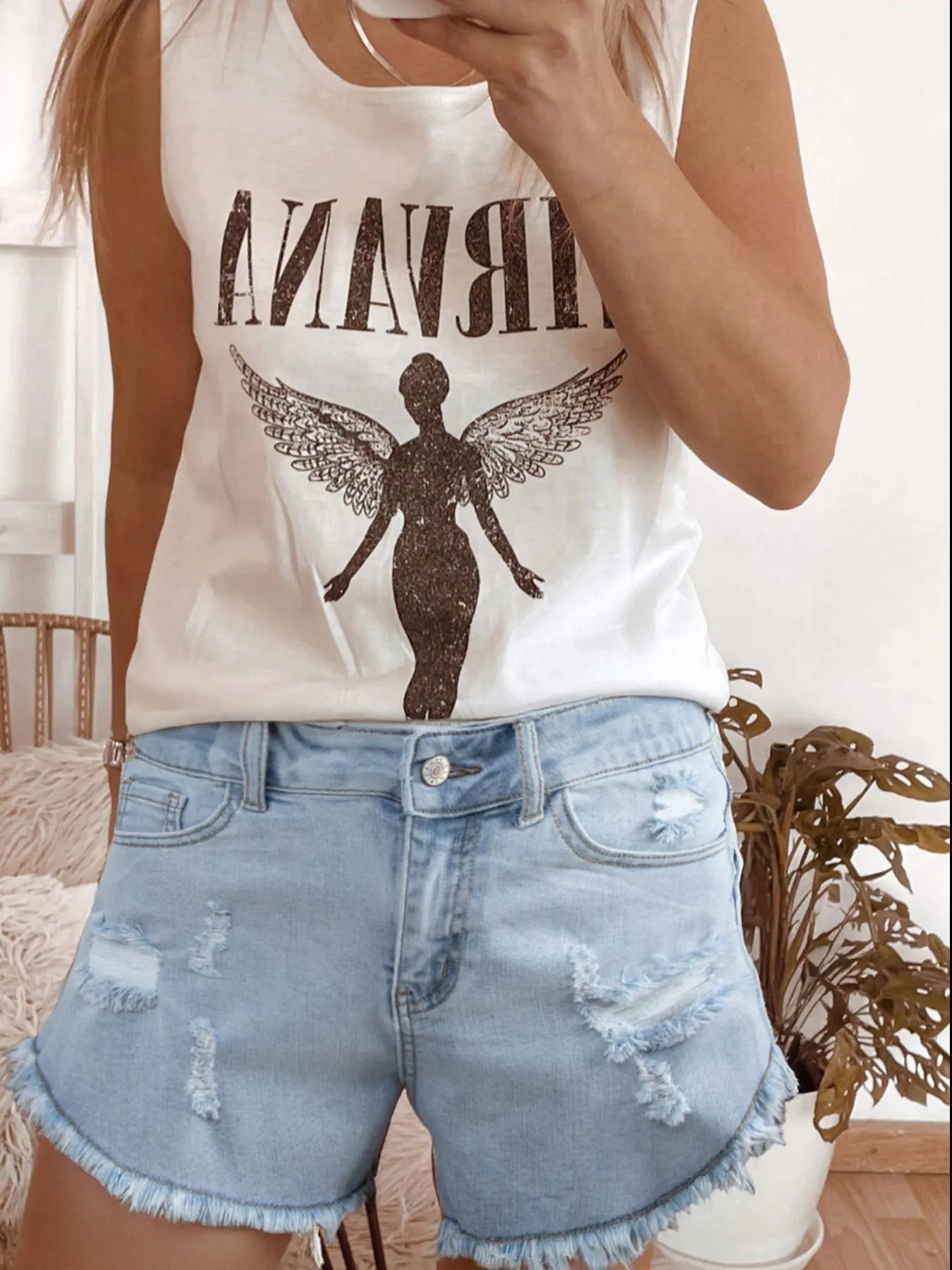 High rise denim shorts offering a stylish and comfortable fit for casual summer wear.