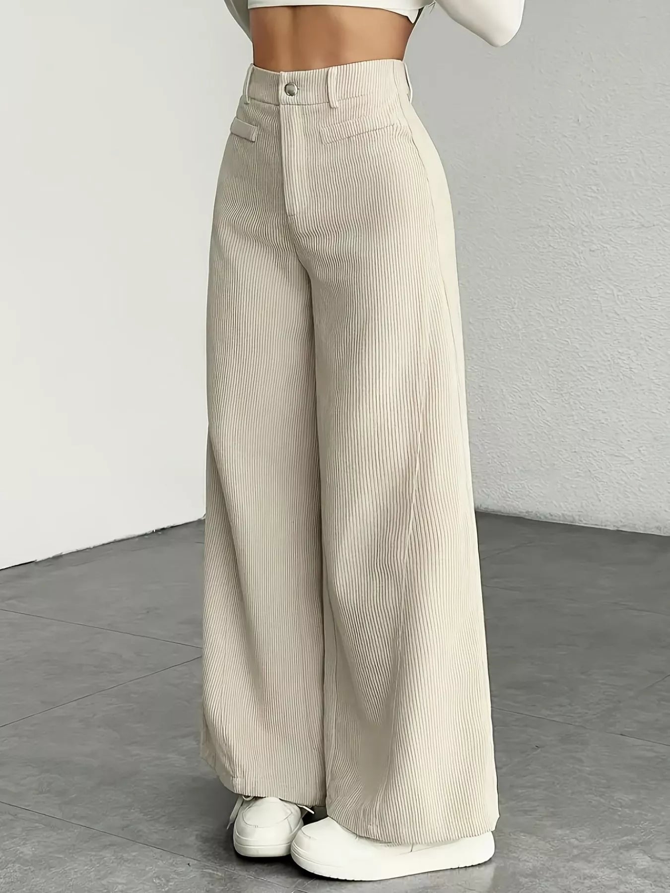 Wide leg pants made from soft corduroy fabric, offering a stylish and comfortable fit for all seasons