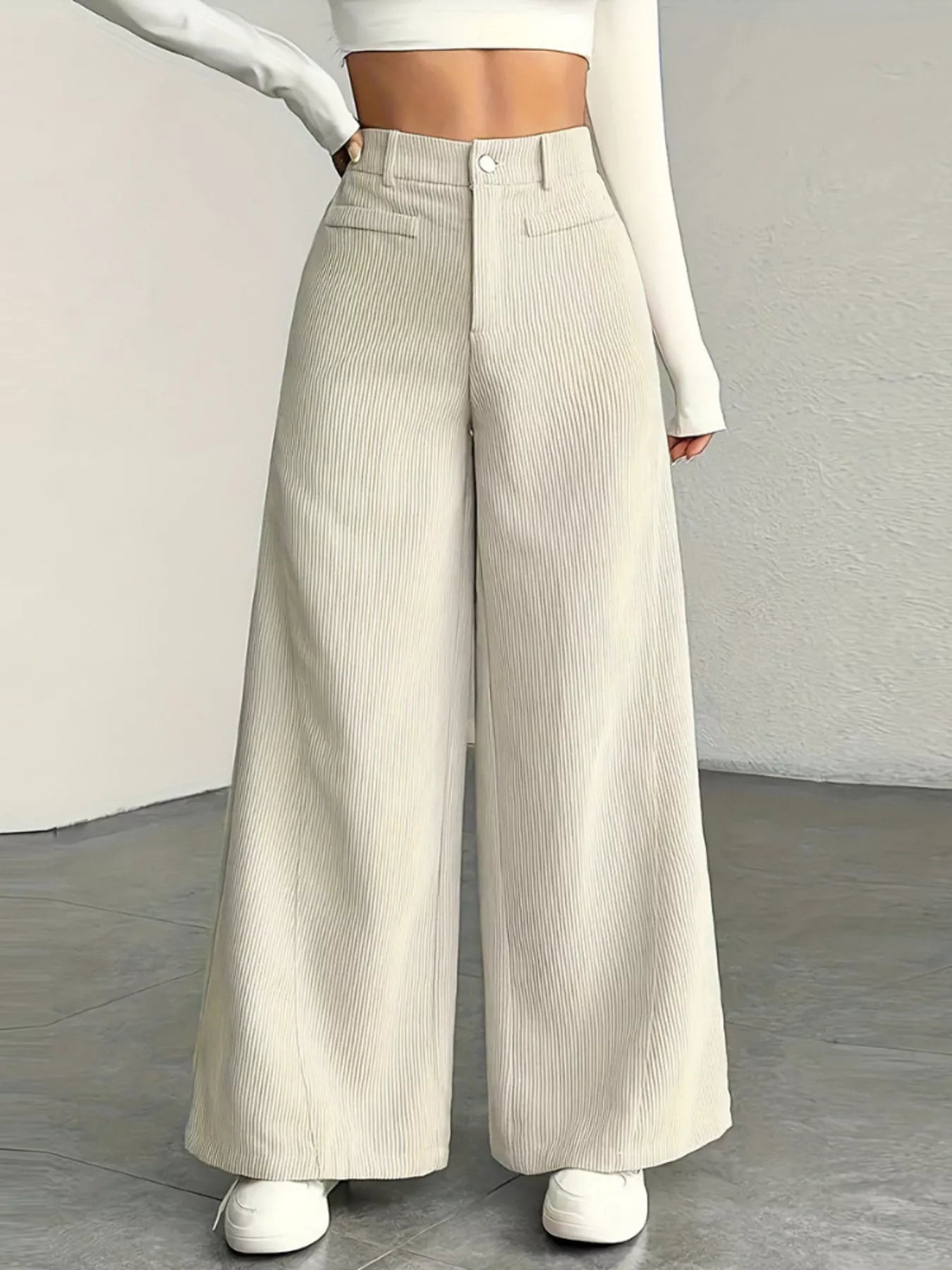 Wide leg pants made from soft corduroy fabric, offering a stylish and comfortable fit for all seasons