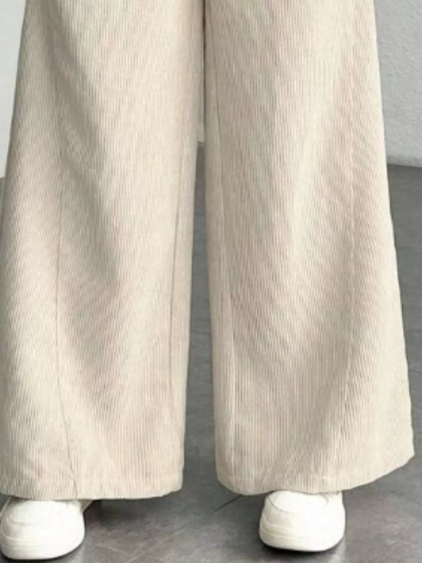 Wide leg pants made from soft corduroy fabric, offering a stylish and comfortable fit for all seasons