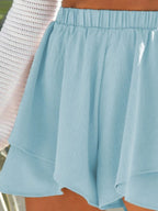 Elegant high-waisted layered shorts showcasing trendy summer fashion and comfortable style for women