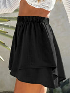 Elegant high-waisted layered shorts showcasing trendy summer fashion and comfortable style for women